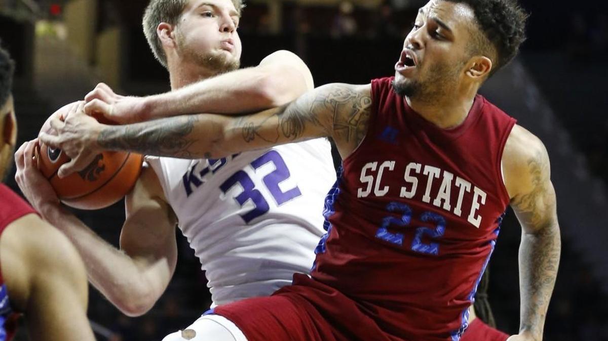 K-State forward Dean Wade fights with South Carolina State guard Eric Eaves for a rebound under the K-State basket earlier this season.