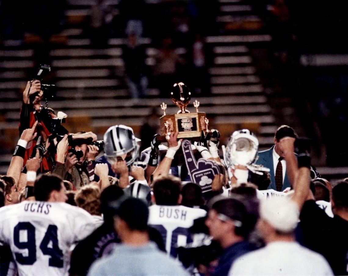 Kansas State football players celebrate a 52-17 win over Wyoming in the 1993 Copper Bowl.