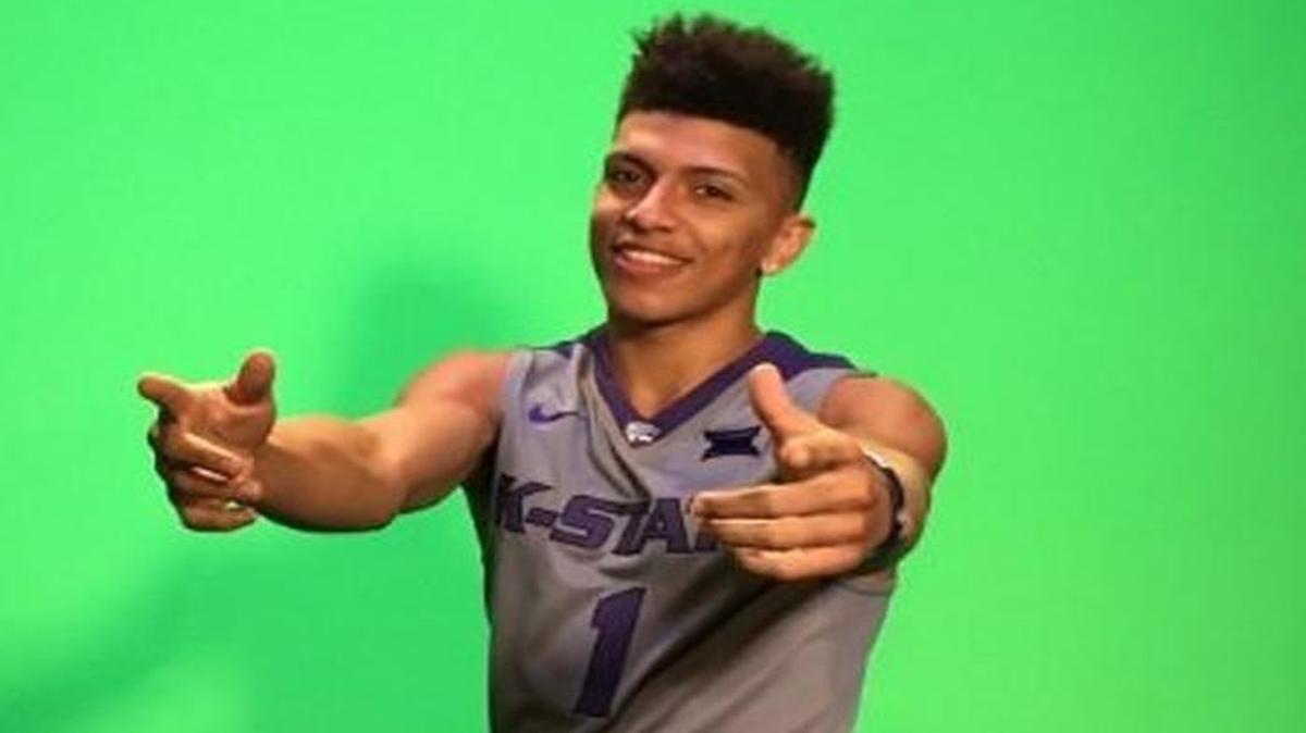 K-State freshman Mike McGuirl poses in a Wildcats uniform while on a recruiting visit to the school last fall.