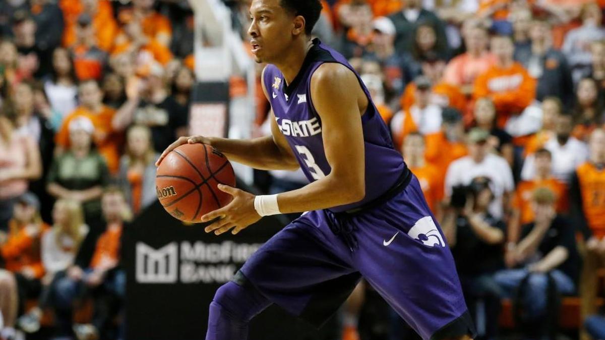 Kansas State guard Kamau Stokes looks to pass against Oklahoma State. (AP Photo/Sue Ogrocki)