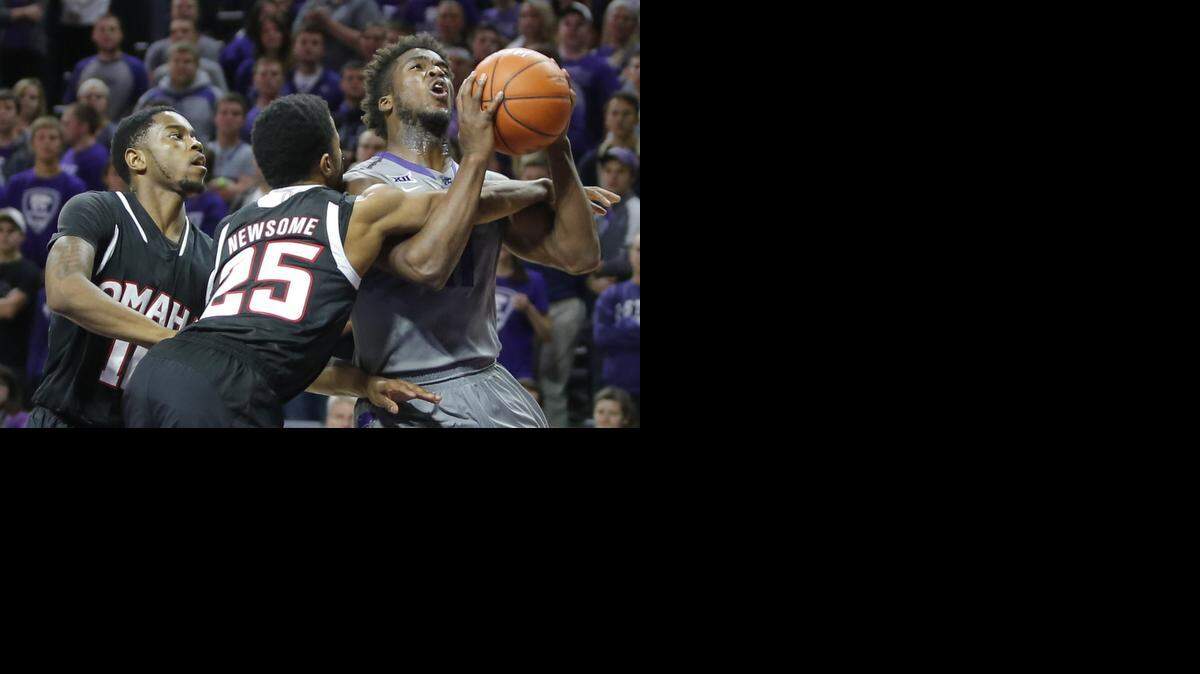 
Kansas State's Nino Williams is fouled by Nebraska-Omaha's Devin Newsome during the first half Tuesday night at Bramlage Coliseum in Manhattan. 
