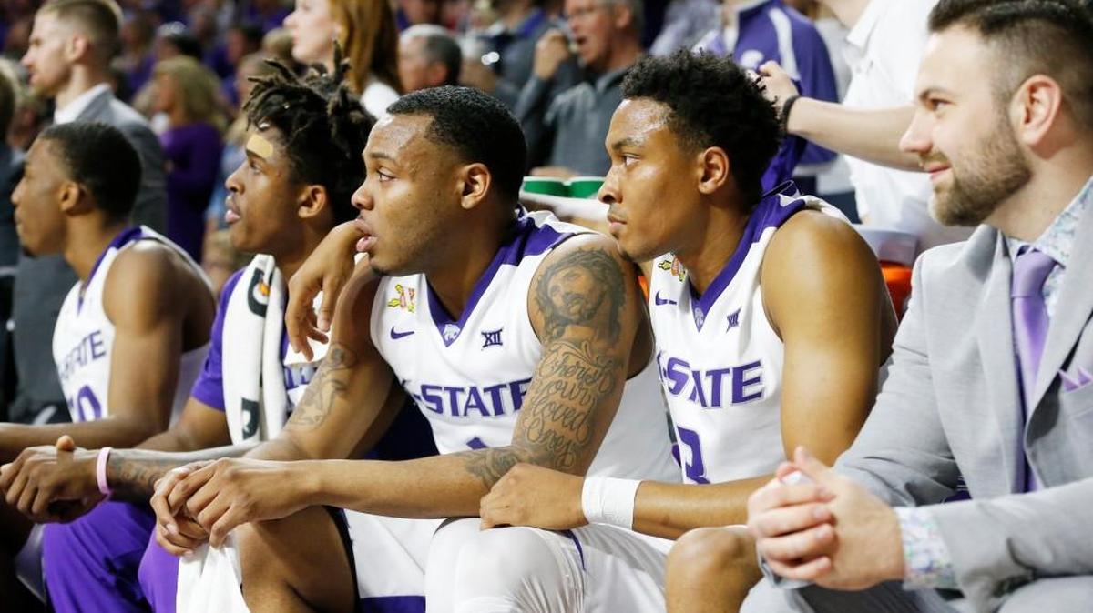 K-State guard Kamau Stokes hugs K-State guard Carlbe Ervin after Ervin left the game late in the second half. The Wildcats won their final two Big 12 games to put themselves in a position to reach the NCAA Tournament.