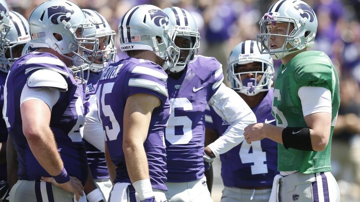 K-State quarterback Jesse Ertz, right, huddles the offense during the Wildcats' annual spring game in April.