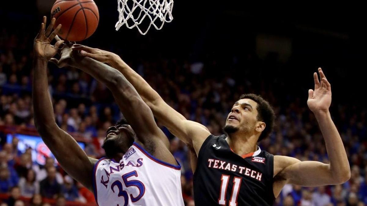 Texas Tech's Zach Smith, right, battle Kansas’ Udoka Azubuike during Tuesday’s game in Lawrence. Tech beat KU by 12 points in Allen Fieldhouse.