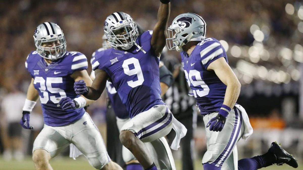K-State linebacker Elijah Lee celebrates an interception against TCU.