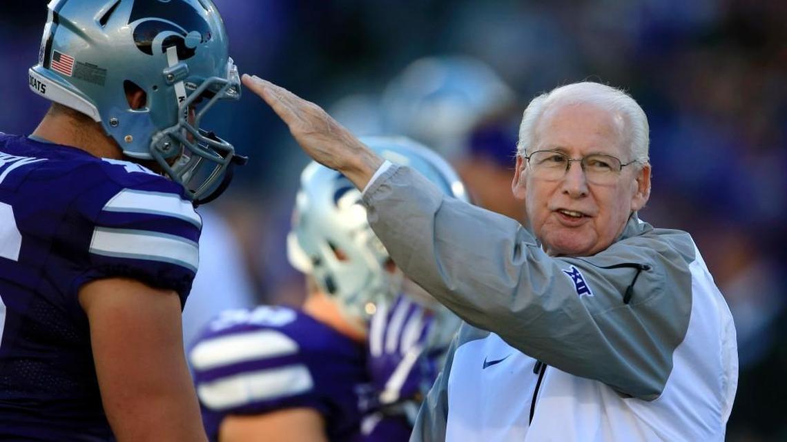 FILE - In this Oct. 8, 2016, file photo, Kansas State head coach Bill Snyder talks with his players before an NCAA college football game against Texas Tech in Manhattan, Kan. The Big 12âs oldest coach is about to meet the youngest. Kansas State’s Bill Snyder, 78, became just the seventh coach in FBS history to coach at least 300 games at one school earlier this season, and a win Saturday at Iowa State would give him 198 career victories, good for 25th all time. (AP Photo/Orlin Wagner, File)