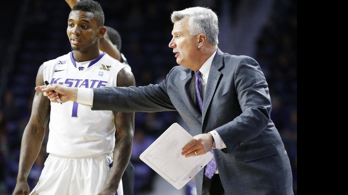 
K-State coach Bruce Weber points out a play to guard Jevon Thomas in December.
