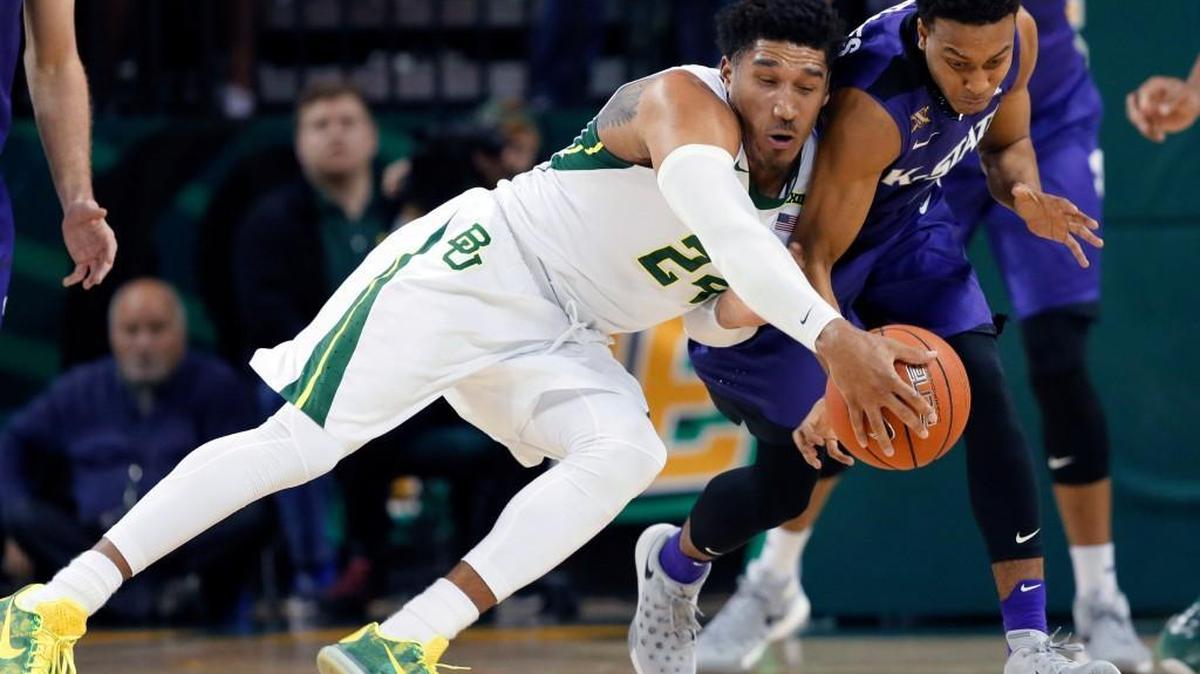 Baylor guard Ishmail Wainright and Kansas State's Kamau Stokes compete for a loose ball in the first half Wednesday in Waco, Texas.