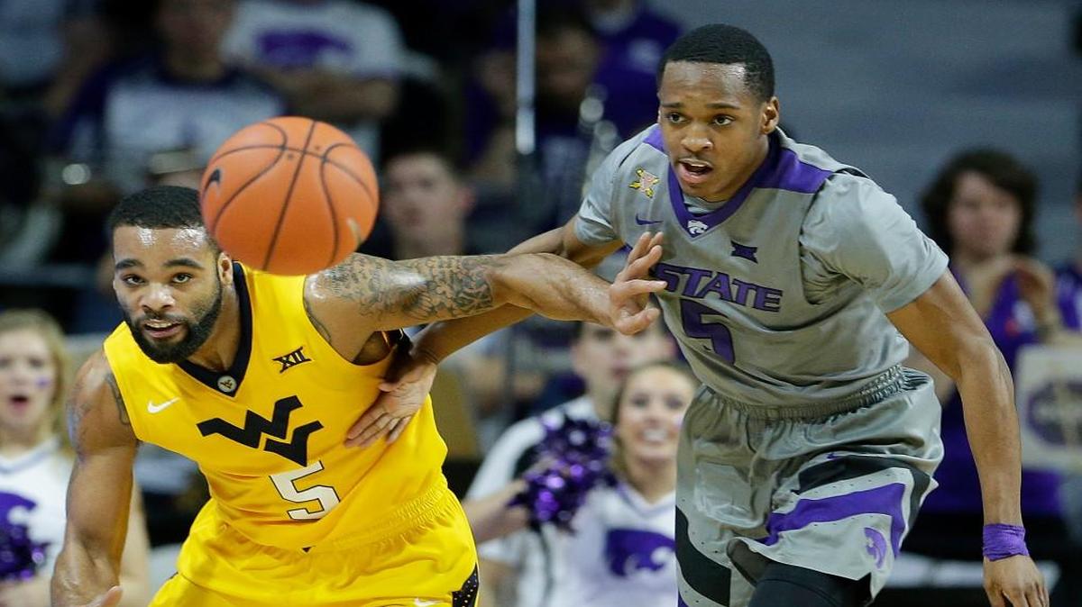 Kansas State’s Barry Brown, right, and West Virginia’s Jaysean Paige chase a loose ball.