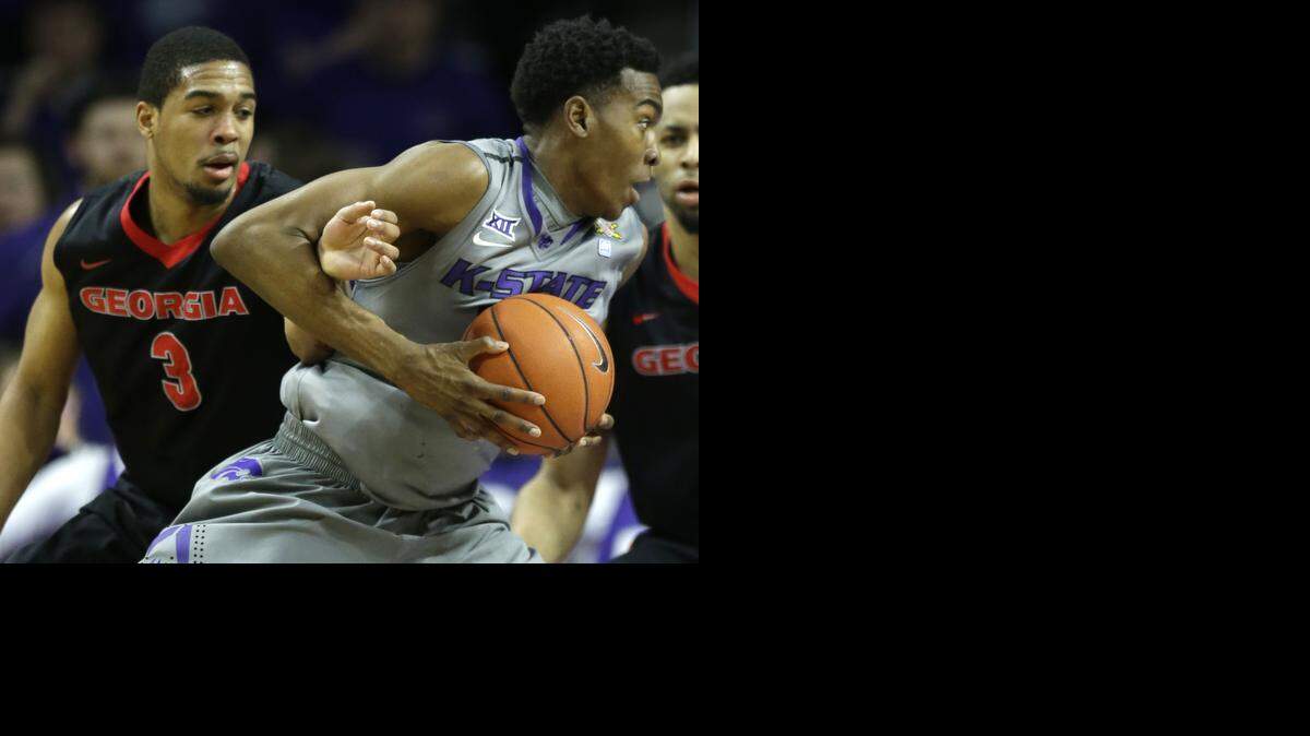 
Kansas State guard Wesley Iwundu, right, is fouled by Georgia guard Juwan Parker during the Bulldogs’ win Wednesday in Manhattan.
