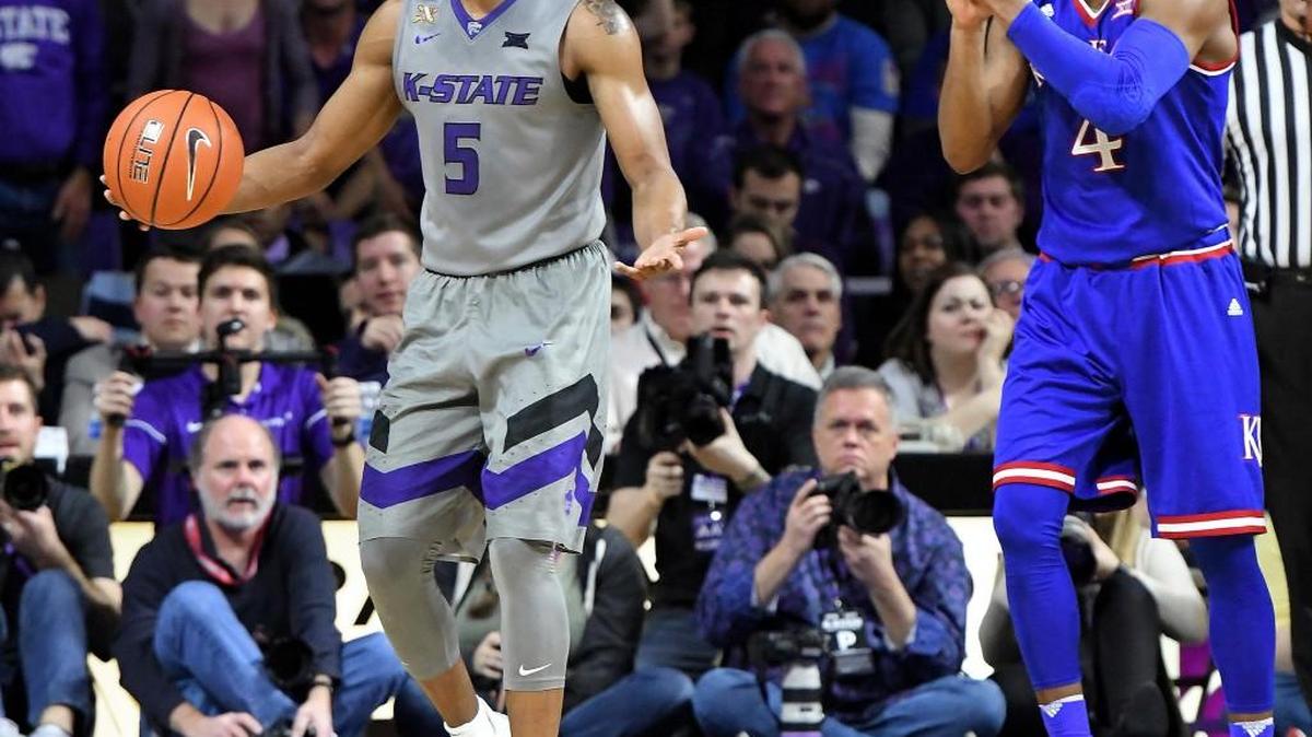 Kansas State guard Barry Brown reacts to being called for a foul as Kansas Jayhawks guard Devonte' Graham applauds at Bramlage Coliseum in Manhattan, Kan. (John Sleezer/Kansas City Star/TNS)