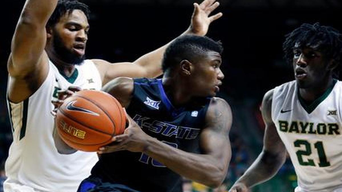 
Kansas State guard Malek Harris, center, is pressured by Baylor forward Rico Gathers, left, and forward Taurean Prince in the first half Saturday in Waco, Texas.
