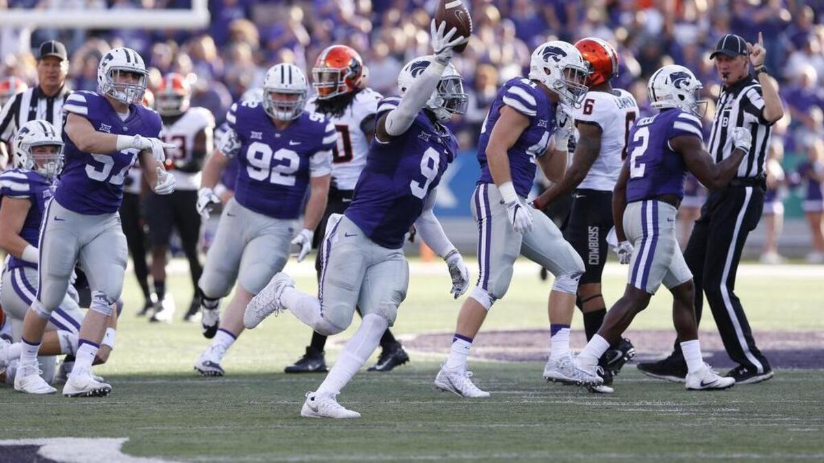 Kansas State linebacker Elijah Lee (9) celebrates recovering an Oklahoma State fumble on a punt on Saturday in Manhattan.