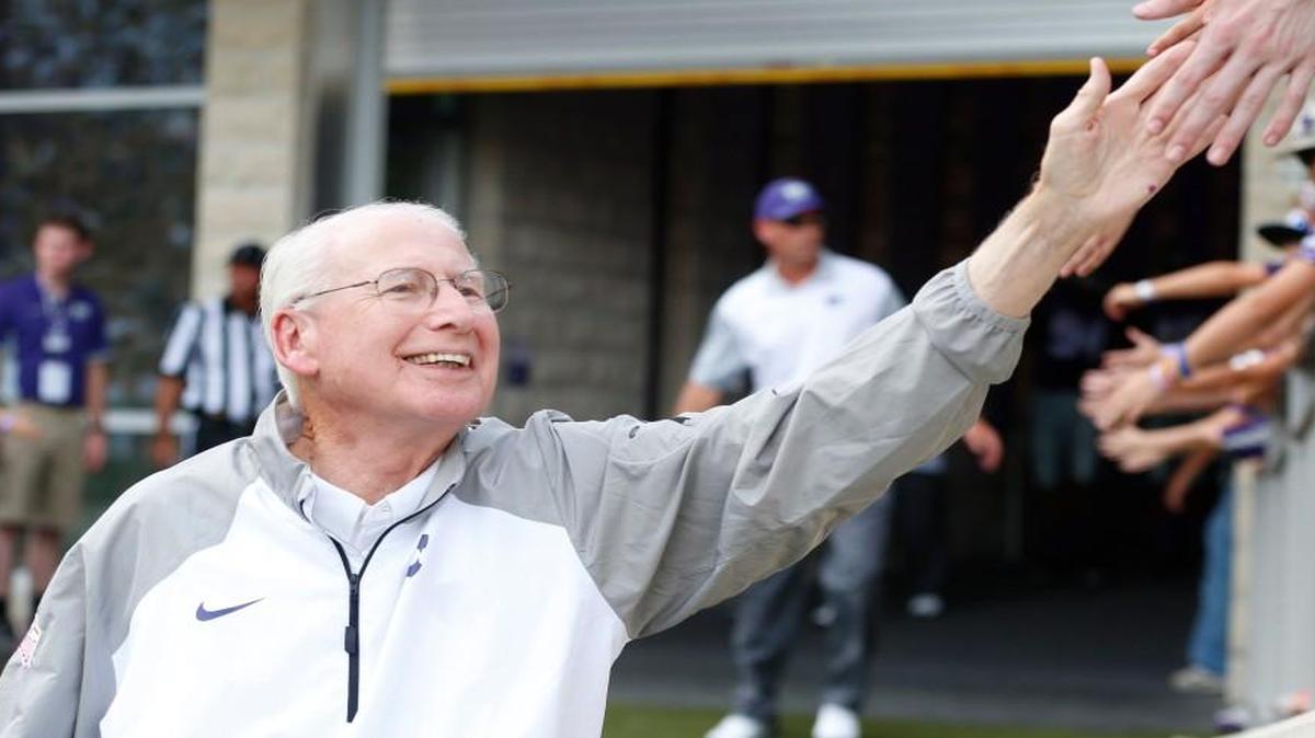 K-State head coach Bill Snyder "high fives" young fans on this way to the field. (September 05, 2015)