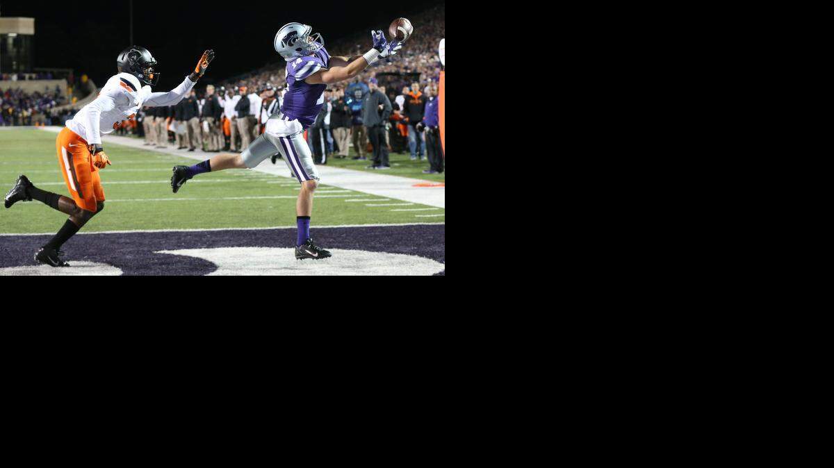
K-State wide receiver Curry Sexton juggles a pass from quarterback Jake Waters, but hangs onto it for a touchdown in the secondnd quarter Saturday in Manhattan.
