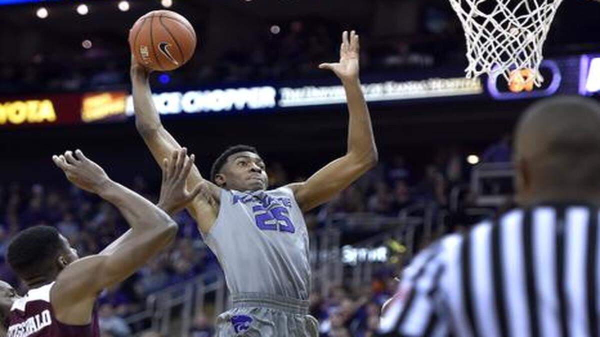 
Wesley Iwundu dunks in the second half against Texas A&M last Saturday at the Sprint Center in Kansas City, Mo. K-State won 71-64. 
