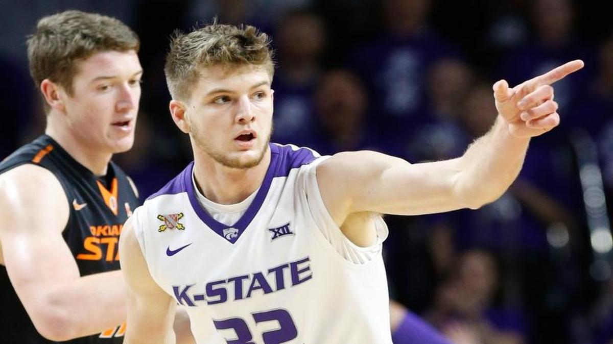 K-State forward Dean Wade points to the bench after shooting a three-point shot against Oklahoma State last month.