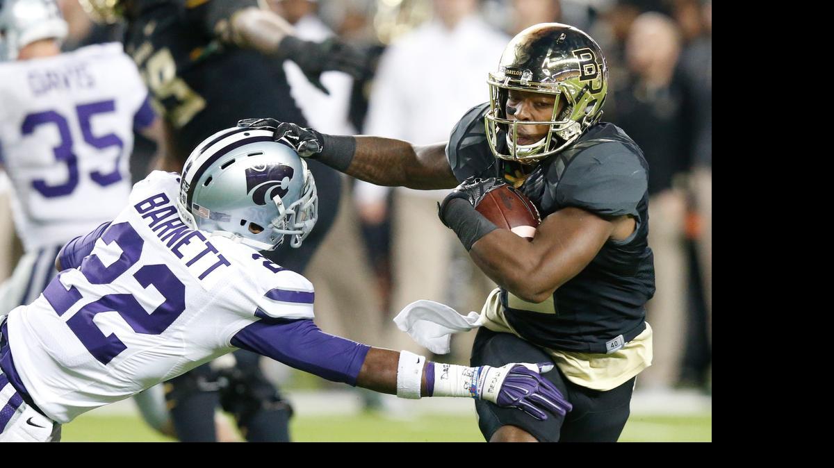 
K-State defensive back Dante Barnett extends for a tackle against Baylor.(December 6, 2014)
