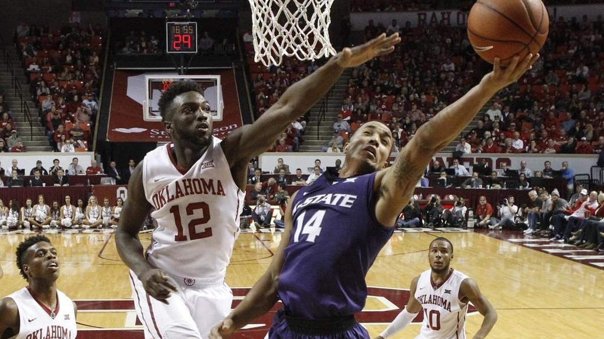 K-State guard Justin Edwards shoots in front of Oklahoma forward Khadeem Lattin on Jan. 9 in Norman, Okla.