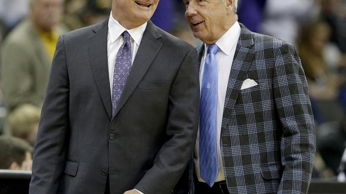 Kansas State coach Bruce Weber, left, and North Carolina coach Roy Williams talk before Tuesday’s game in Kansas City.