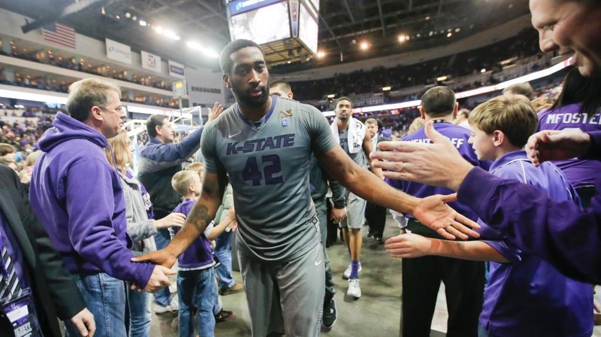 Kansas State's Thomas Gipson is congratulated after his team upset No. 21 Gonzaga at Intrust Bank Arena in December 2013.