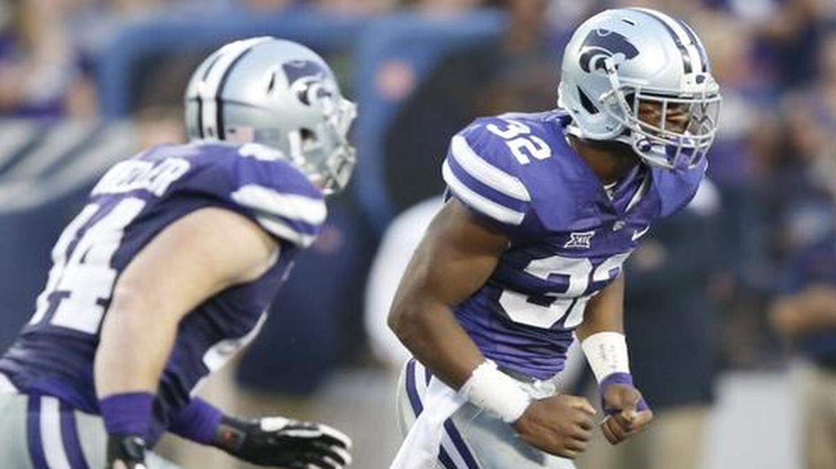 
K-State linebacker Dakorey Johnson (32) celebrates an interception during the first half of the Auburn game.
