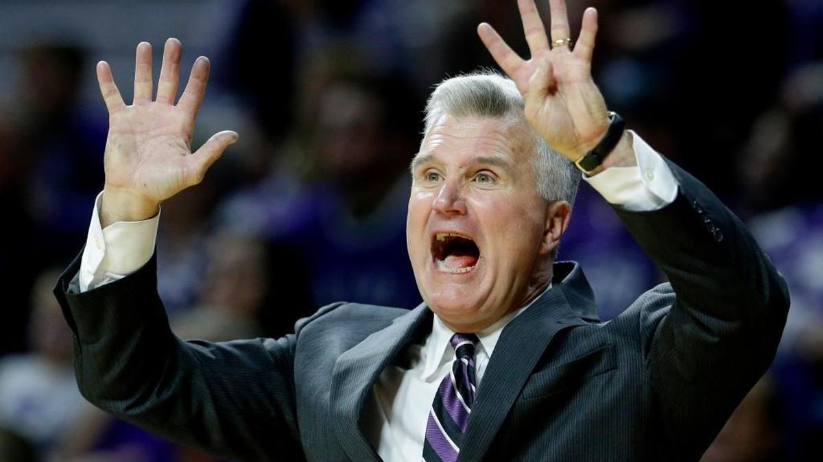 Kansas State coach Bruce Weber motions to his players during a game against West Virginia .