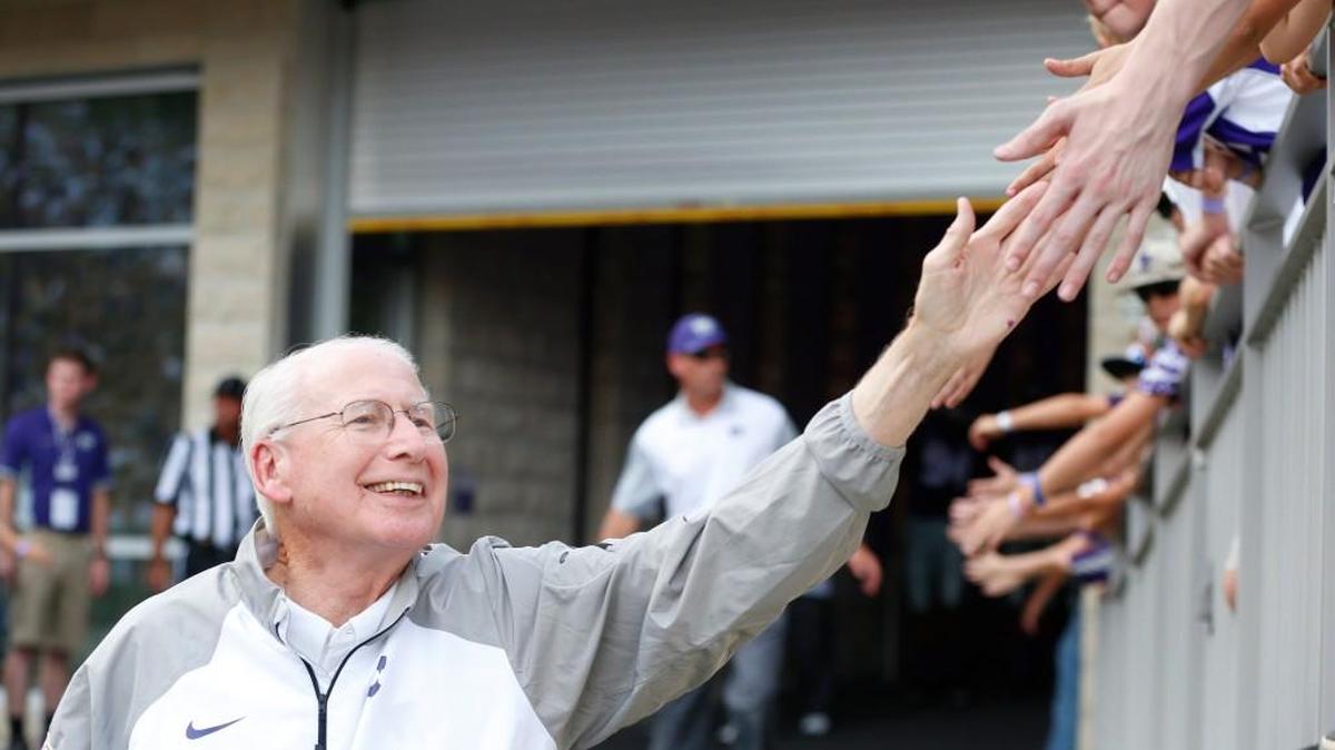 K-State coach Bill Snyder "high fives" young fans on this way to the field. (September 05, 2015)