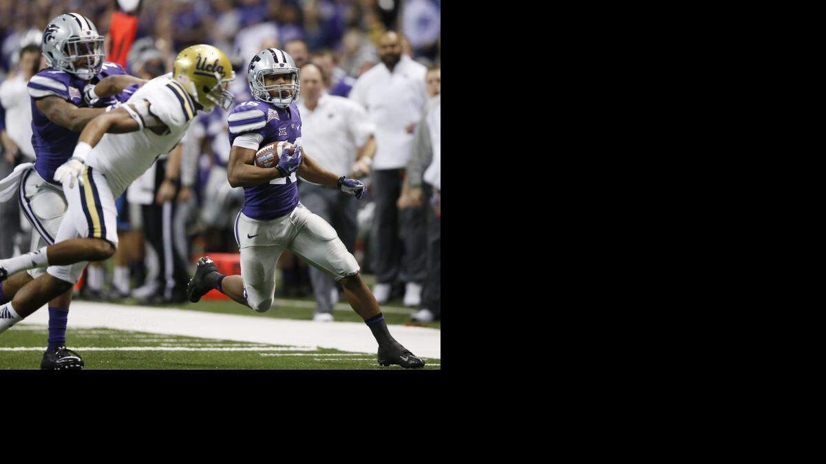 
K-State senior Tyler Lockett makes a long punt return in the second quarter against UCLA on Friday night at the Alamo Bowl. 
