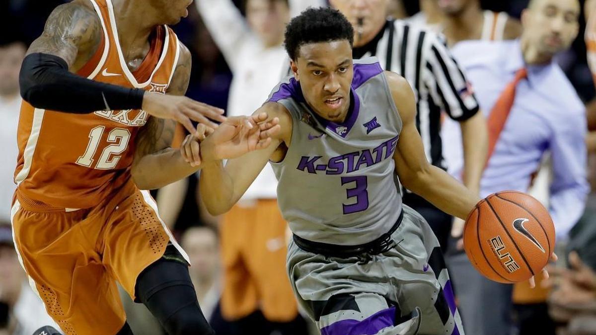 Kansas State guard Kamau Stokes is pressured by Texas' Kerwin Roach at Bramlage Coliseum. (AP Photo/Charlie Riedel)