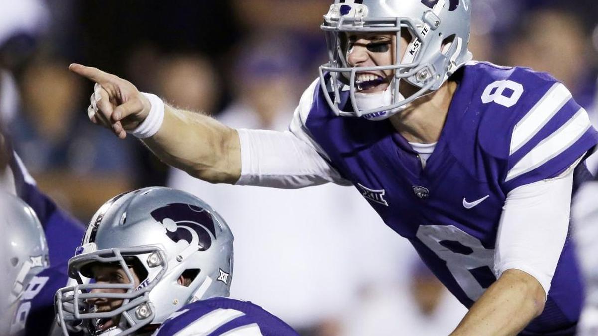 Kansas State quarterback Joe Hubener points out the defense to offensive lineman Dalton Risner against TCU last month.