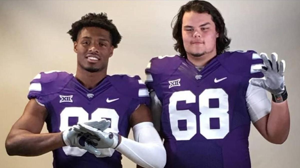 K-State commits Cartez Crook-Jones and Shane Cherry pose for a photo in full uniform while on a recruiting visit.