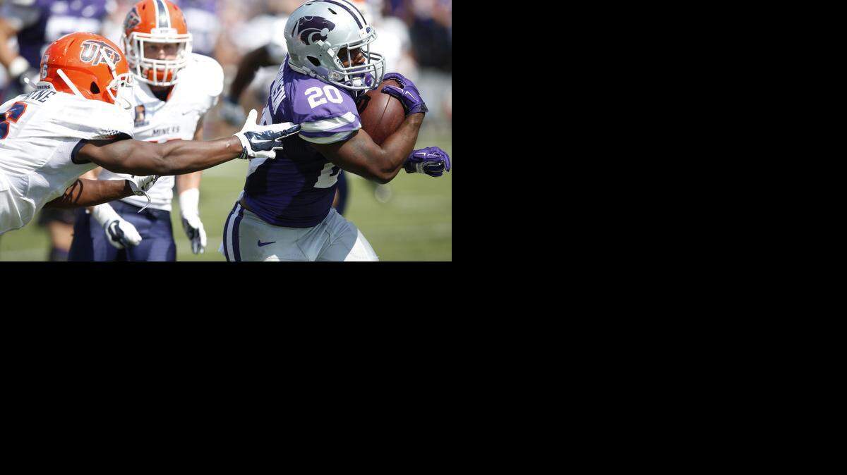 
K-State running back DeMarcus Robinson (20) slips past UTEP defensive back Damian Payne (6) on his way to a 40-yard touchdown run in the third quarter.
