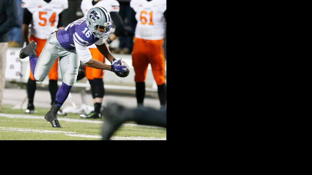 
K-State wide receiver Tyler Lockett dives for a Jake Waters pass against Oklahoma State in the third quarter Saturday in Manhattan.
