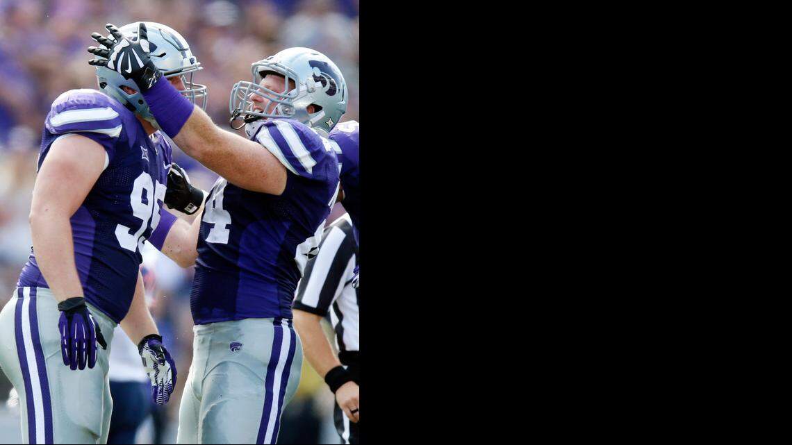 
K-State defensive lineman Travis Britz (95) and defensive end Ryan Mueller (44) celebrate Britz’s sack of UTEP quarterback Jameill Showers on Sept 27.
