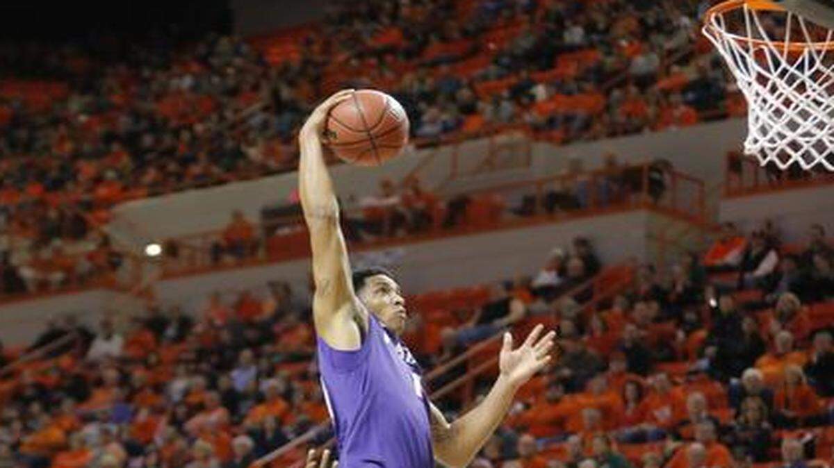 
Kansas State guard Justin Edwards goes up for a dunk in front of Oklahoma State forward Le'Bryan Nash during the first half on Saturday in Stillwater. Despite being up at the end of the first half, Kansas State faded in the second and lost 61-47.

