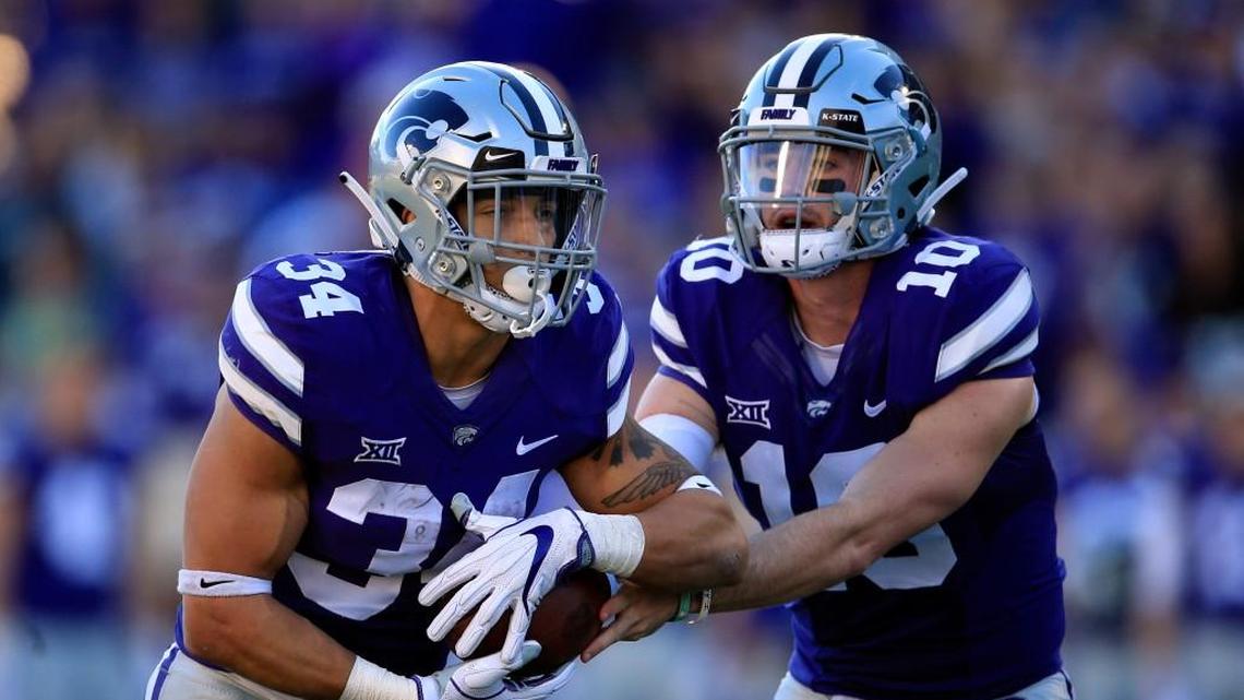 Kansas State running back Alex Barnes (34) and quarterback Skylar Thompson (10) during the first half Saturday in Manhattan.