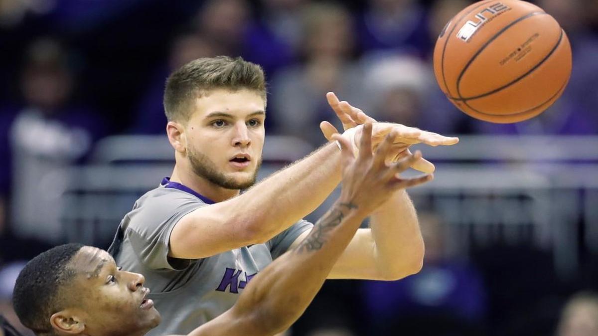 Dean Wade, top, is part of a rare size advantage for Kansas State against Kansas. The Sunflower State rivals meet Tuesday night in Lawrence.