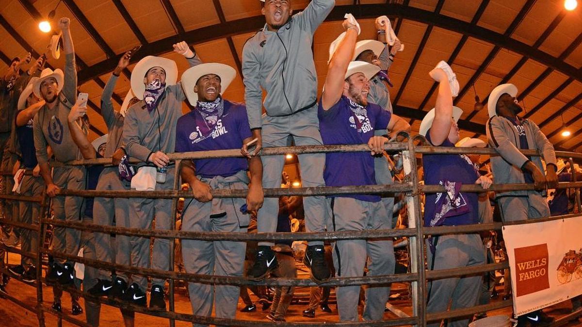 Kansas State football players celebrate a victory at a rodeo event before the Texas Bowl (Scott Weaver, K-State athletics).