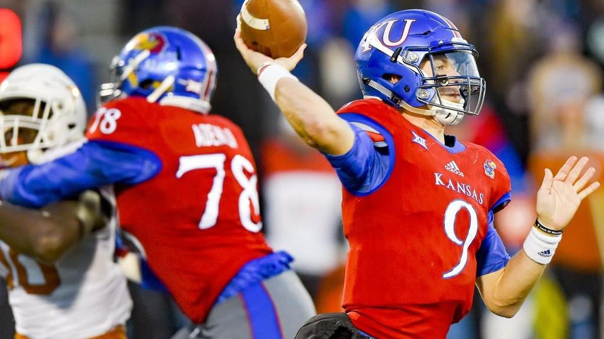 Kansas quarterback Carter Stanley attempts a pass against Texas last Saturday. KU won 24-21 in overtime to break a 19-game Big 12 losing streak.