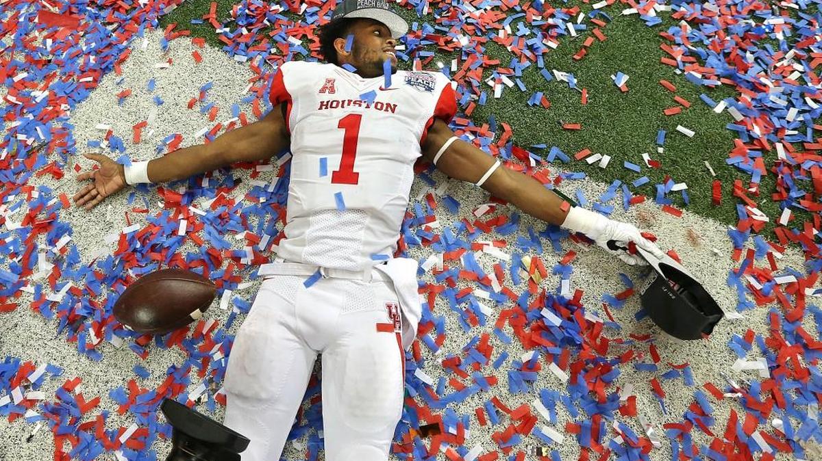 Houston quarterback Greg Ward Jr. revels in the confetti after they defeated Florida State 38-24 in the Peach Bowl. (Curtis Compton/Atlanta Journal-Constitution via AP)