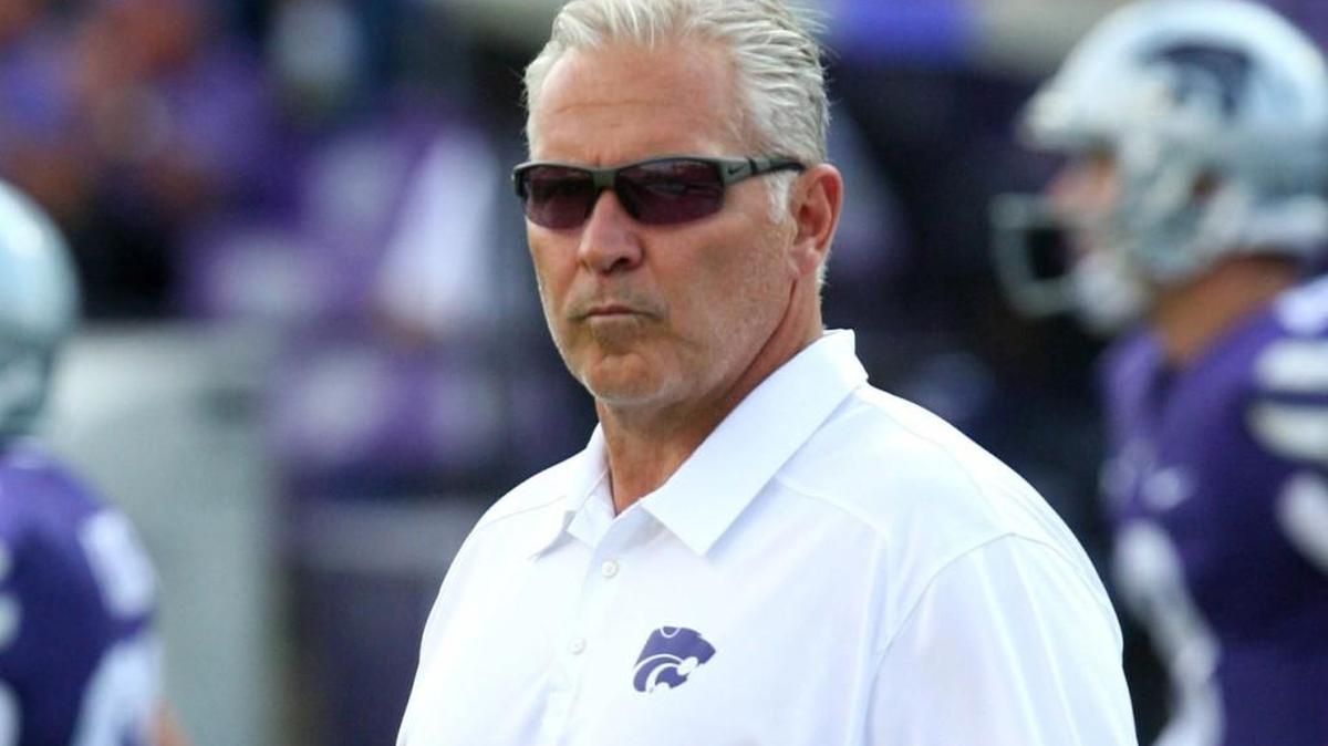 Kansas State offensive coordinator Dana Dimel watches as the Wildcats warm up before a game.