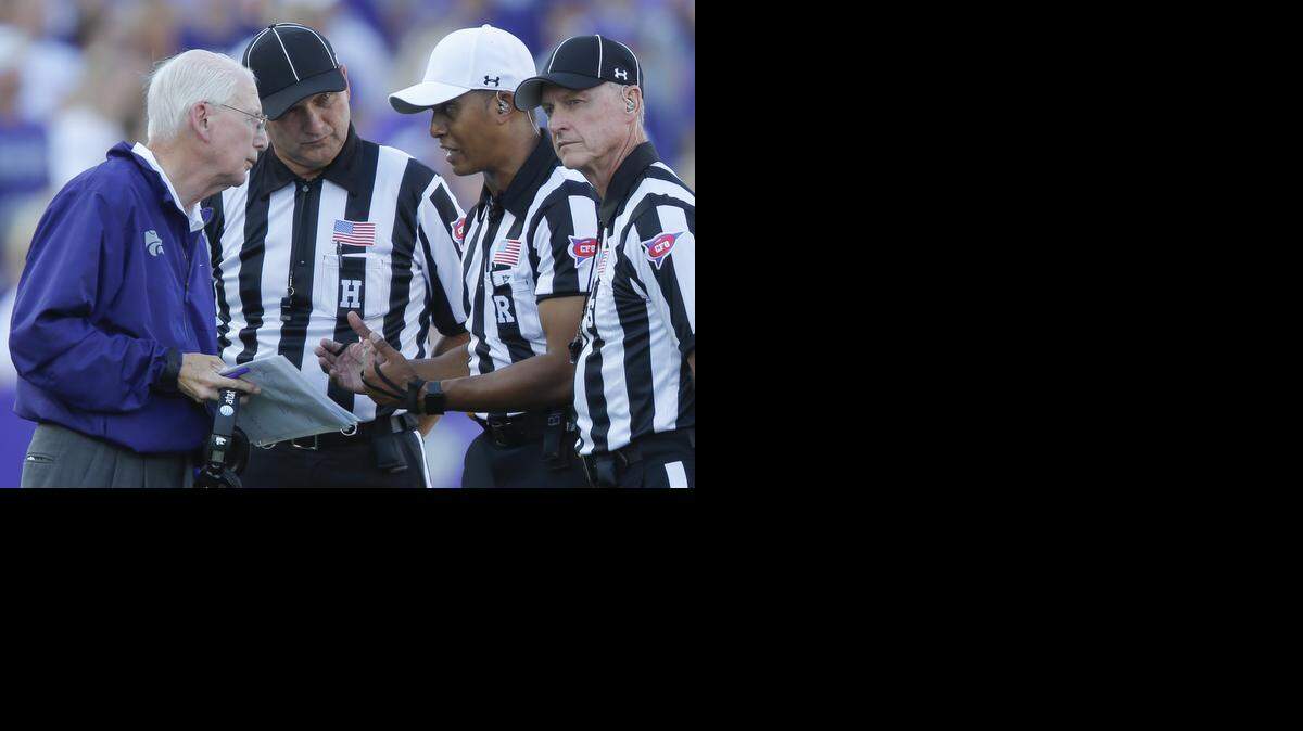 
Kansas State coach Bill Snyder talks with the officials during the first half against Stephen F. Austin on Saturday night.

