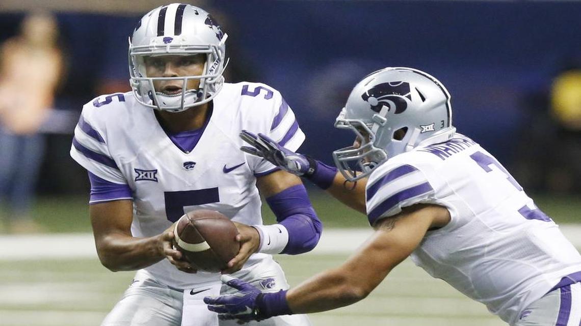 
Kansas State quarterback Alex Delton hands off to running back Dalvin Warmack in the closing minutes last Saturday against Texas-San Antonio. Delton injured his knee in during the few snaps he took. 
