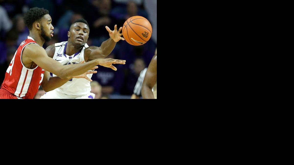 
Kansas State's Malek Harris, right, knocks the ball away from Bradley's Josh Cunningham during the first half Tuesday in Manhattan.
