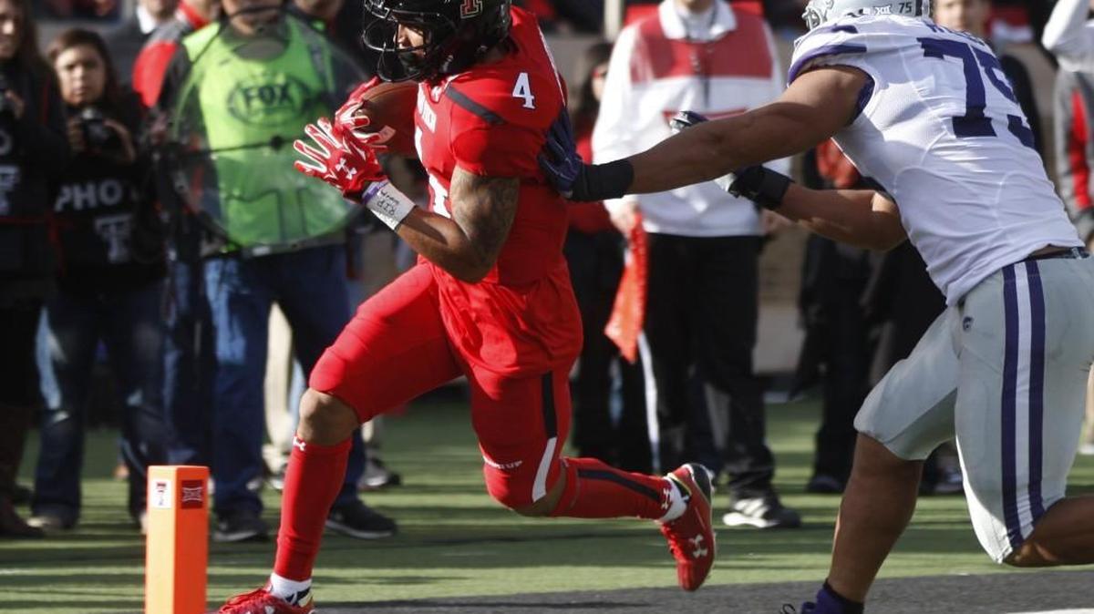 Texas Tech running back Justin Stockton makes a touchdown run against K-State last season in Lubbock, Texas.