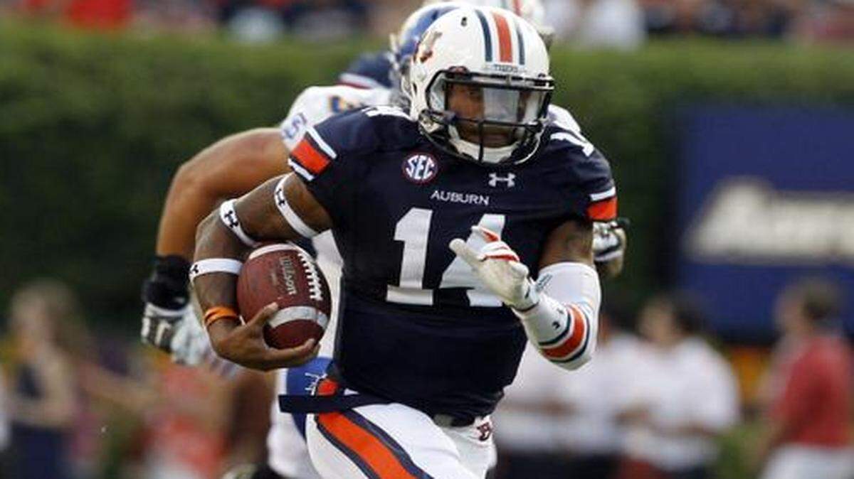 
Auburn quarterback Nick Marshall runs for a first down last week against San Jose State.
