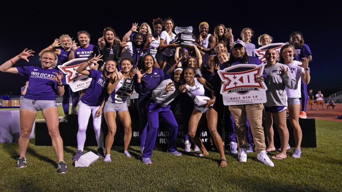 The K-State women celebrate their championship after the Big 12 outdoor championships Sunday in Lawrence.
