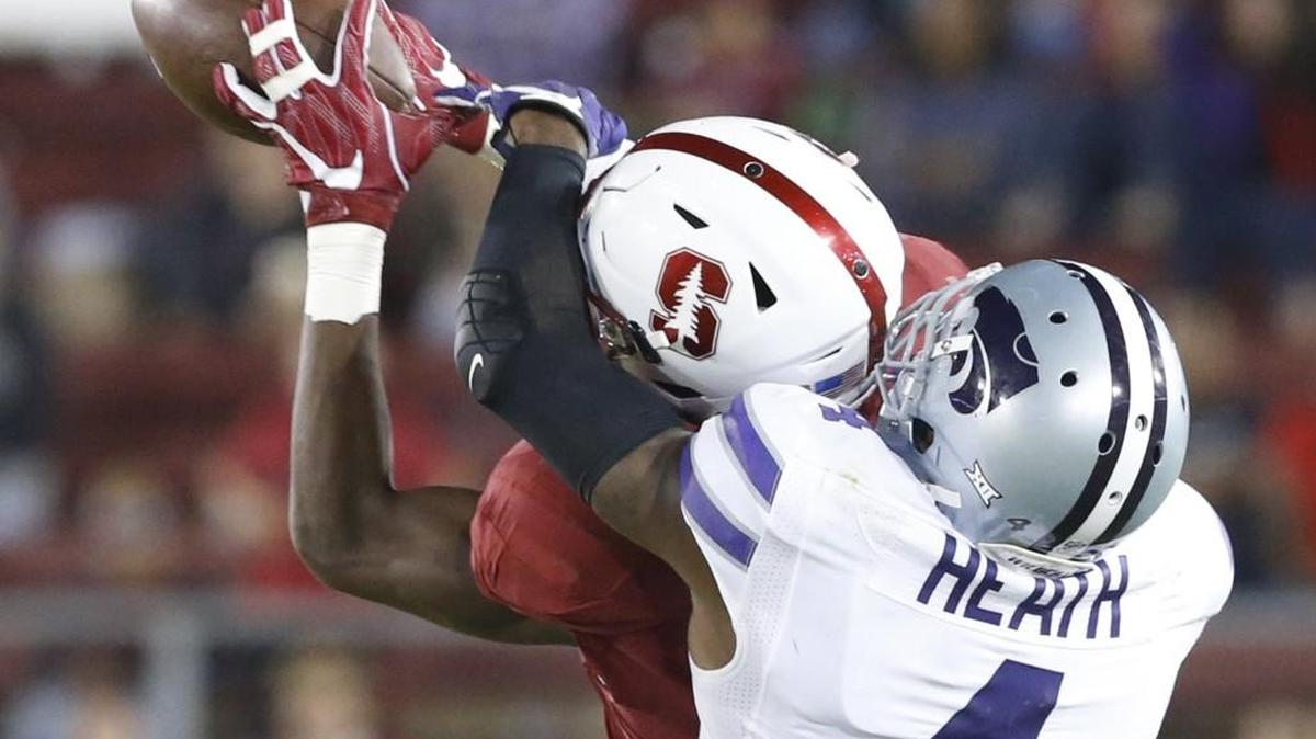 Stanford cornerback Quenton Meeks (24) intercepts a pass intended for K-State wide receiver Dominique Heath in the fourth quarter.
