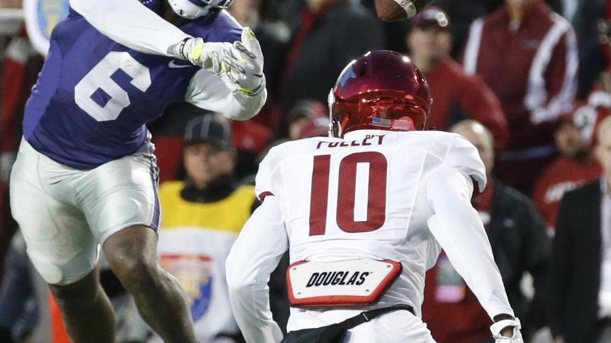 Deante Burton (6) can’t grab an off-target throw from K-State quarterback Kody Cook in the second half of the Liberty Bowl on Saturday.